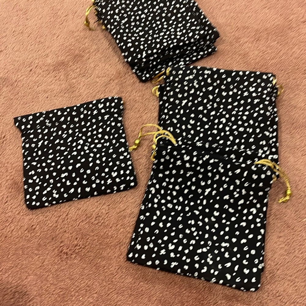 New (18) pieces all new and fully lined /draw string /metal ball at the end .